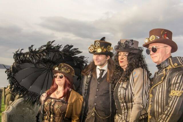 A family of goths dressed up for Whitby Goth Weekend