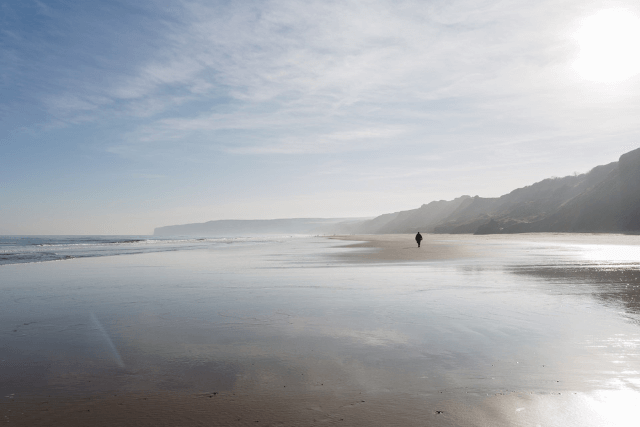 solo person walking on filey beach