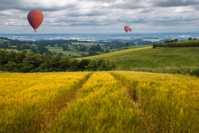 Hot air balloons drifting over the East Yorkshire Wolds in the United Kingdom
