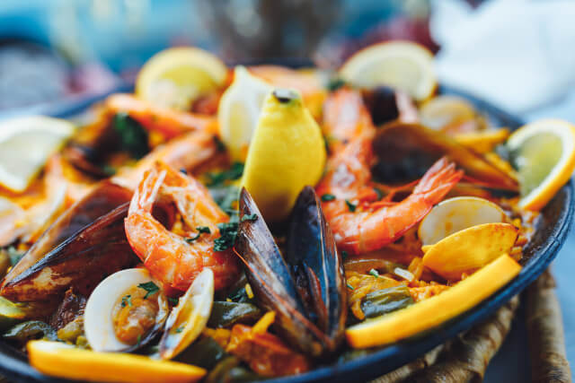 A dish of muscles and seafood served in a bowl