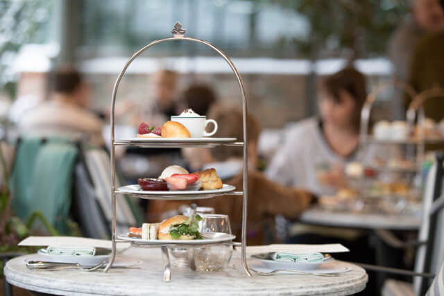 A three tier afternoon tea on a table