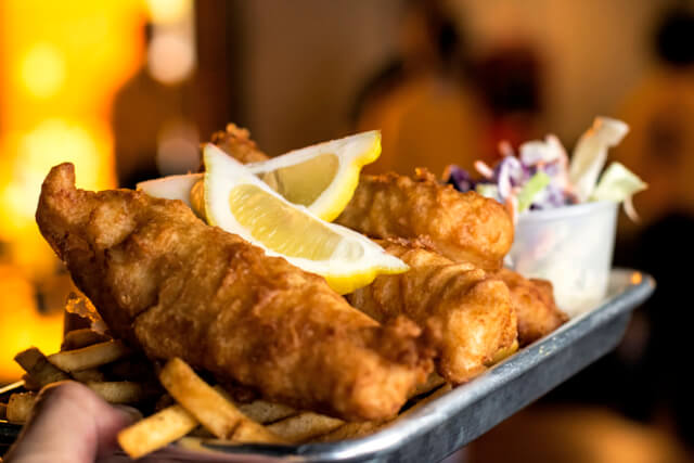 Fish and chips on a plate in a restaurant