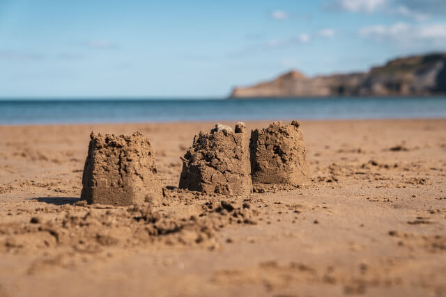 Sandcastles built on the sand on a beach