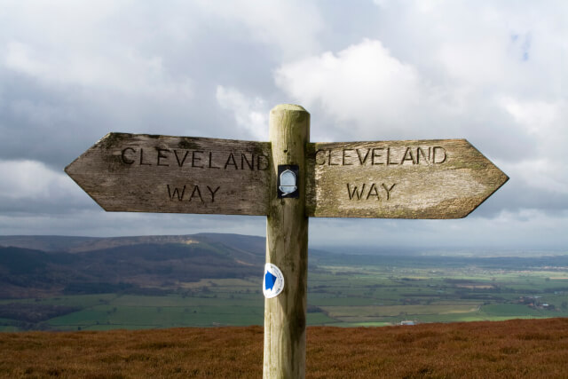 Cleveland Way Signpost with the countryside in the background