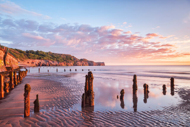 A far reaching view across Sandsend Beah at sunset