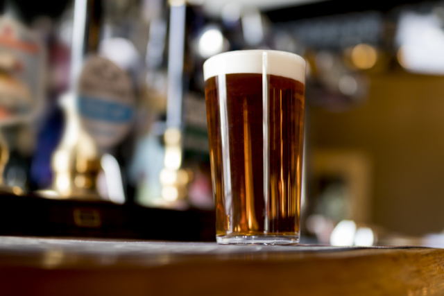 Pint of real ale on the bar in a traditional English pub