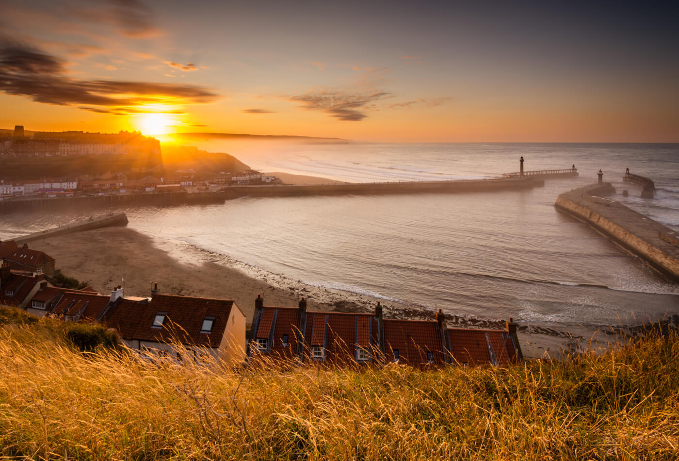 An ariel view of Whitby harbour at sunset