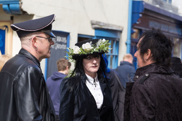 Three visitors dressed in black at Whitby Goth Weekend